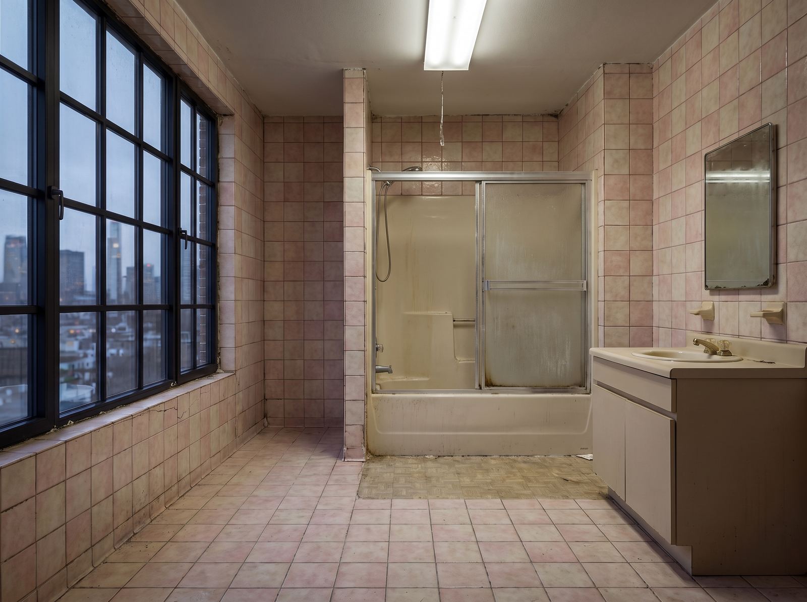 Bathroom before renovation, dated and worn
